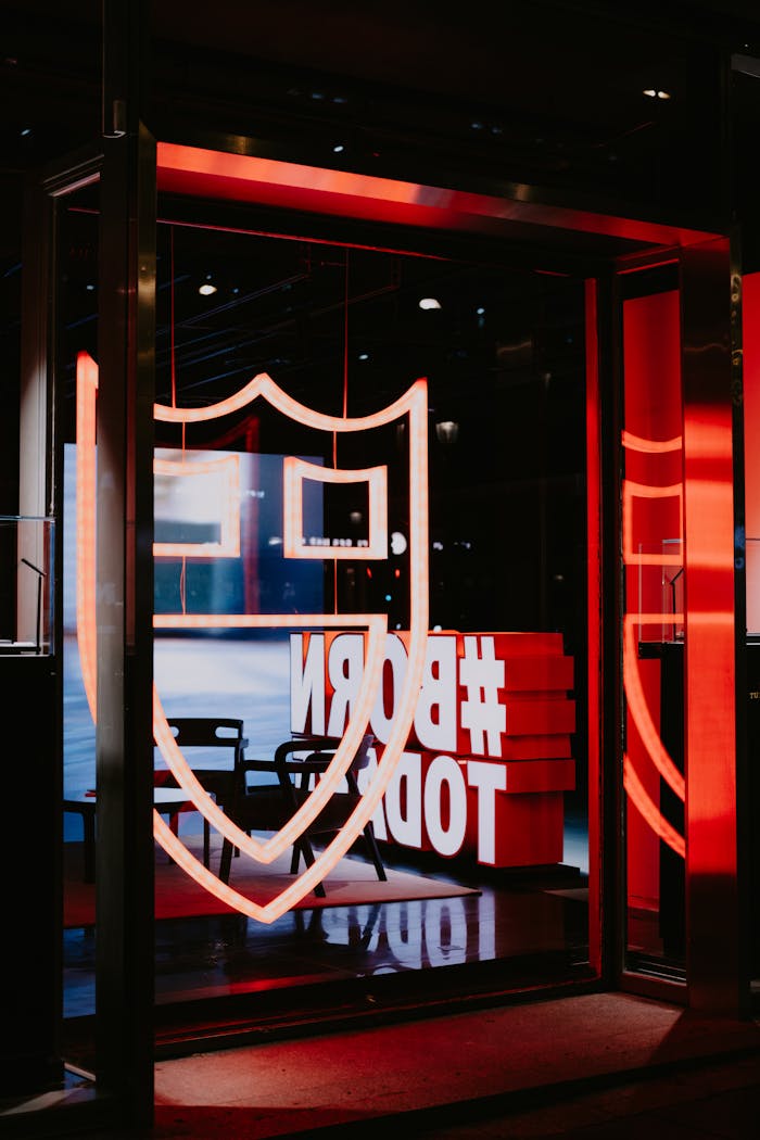 Contemporary entrance with neon signage and a modern aesthetic, featuring an illuminated doorway.